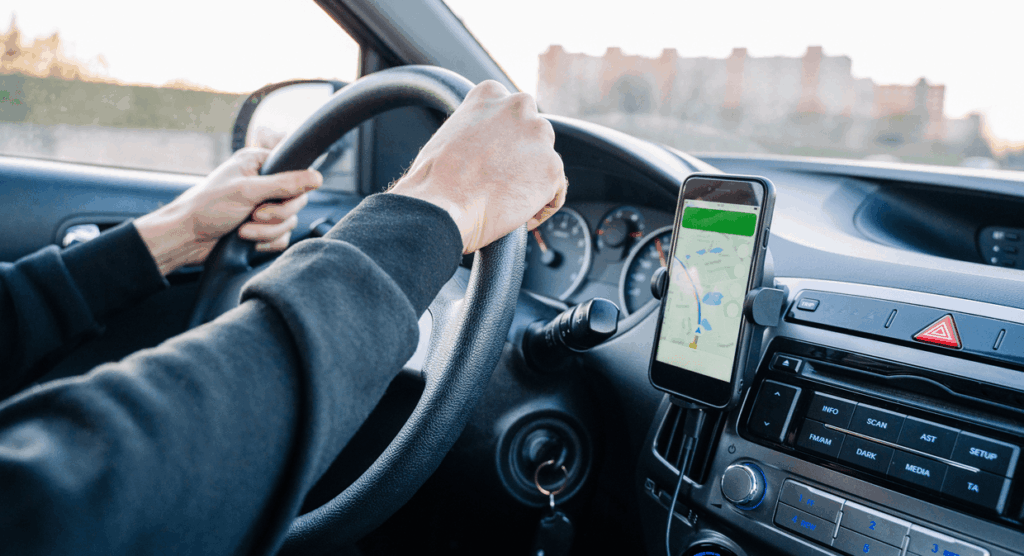 person driving safely with hands free use of their mounted phone
