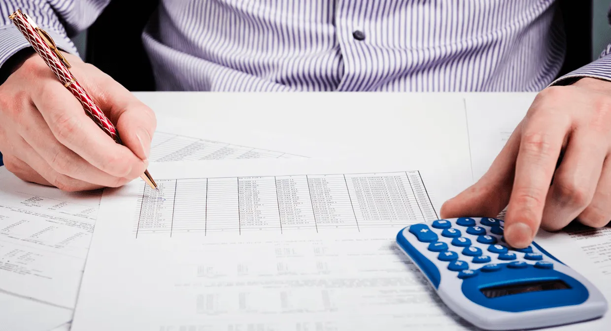 man calculating accident settlement