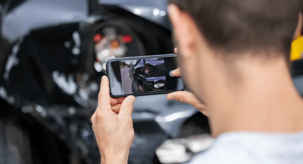  man recording video of his car accident